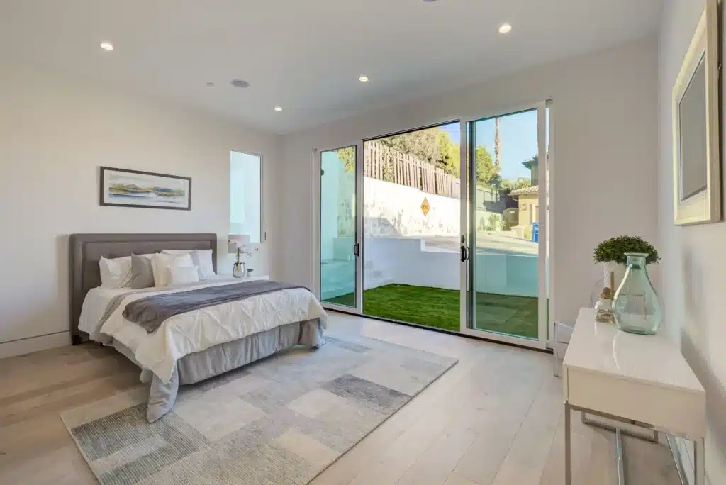 Bedroom opening to a patio in a Hermosa Beach custom home