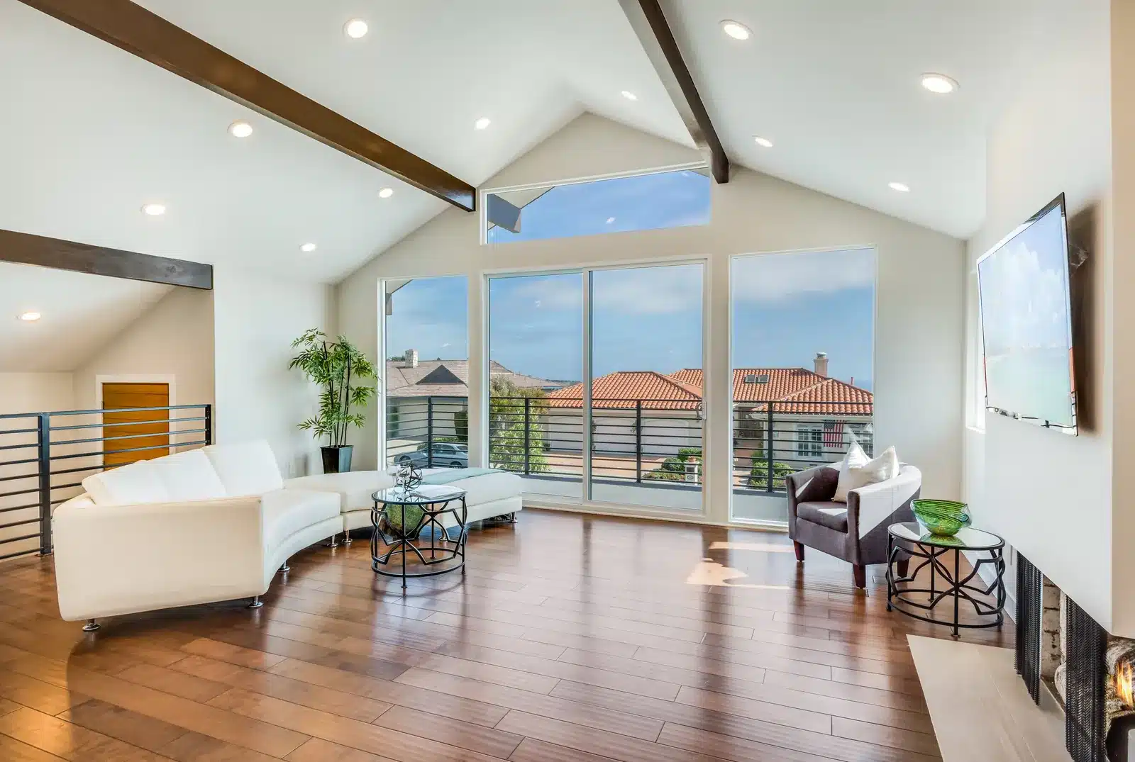 Living room with vaulted ceiling and ocean view in the remodeled Rancho Palos Verdes home
